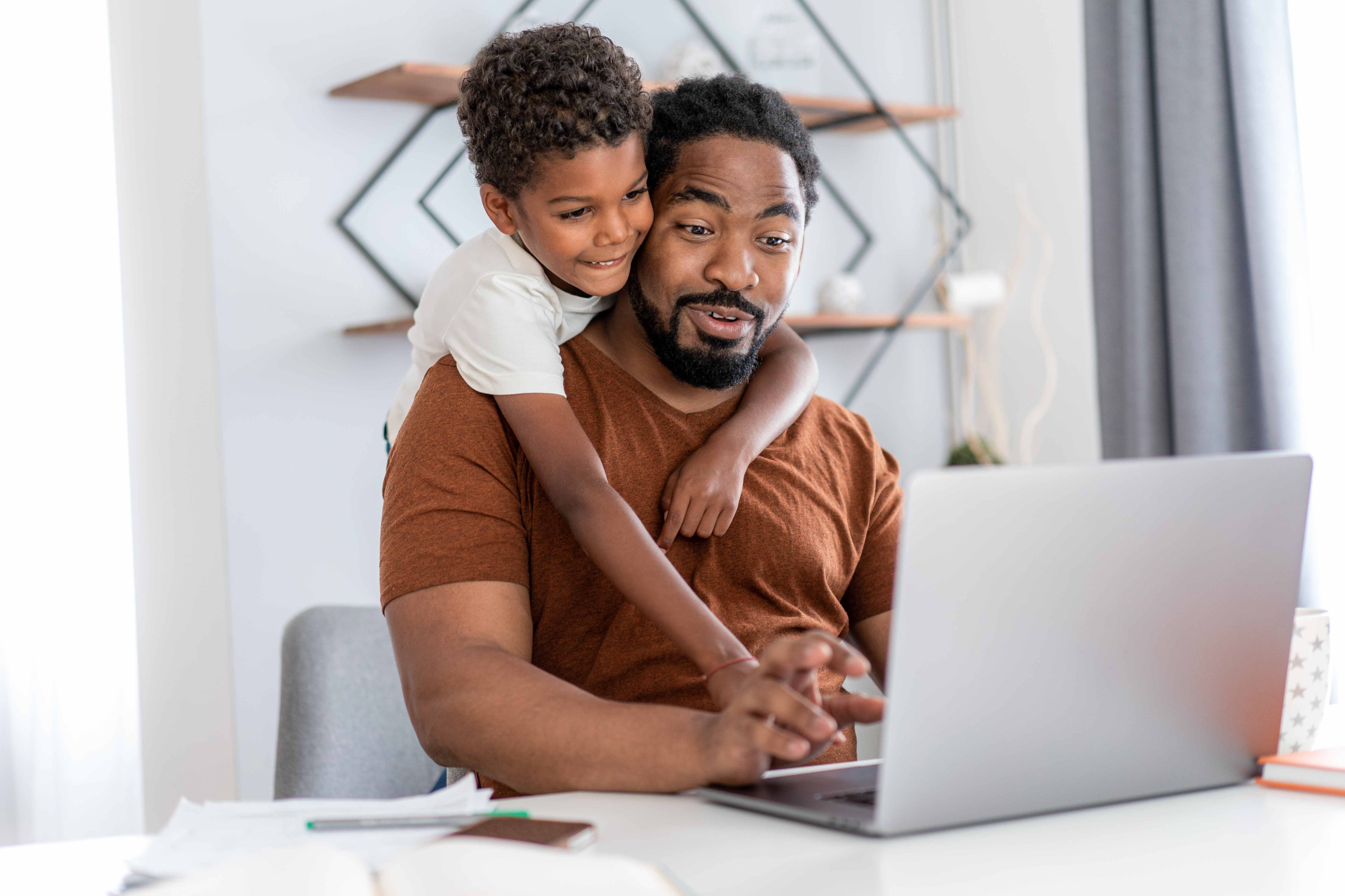 Father and son working together on financial planning